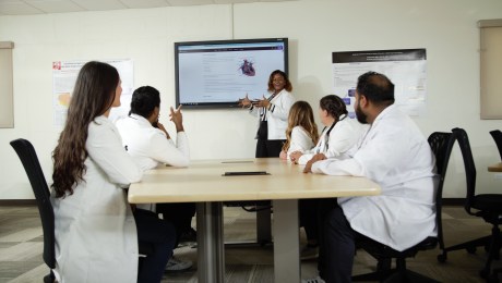 A Group of Students Attentively Listening to their MUA Lecturer's Explanation.