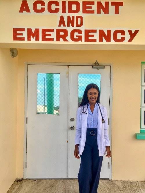 Chante Smith MUA standing in front of an accident and emergency sign.