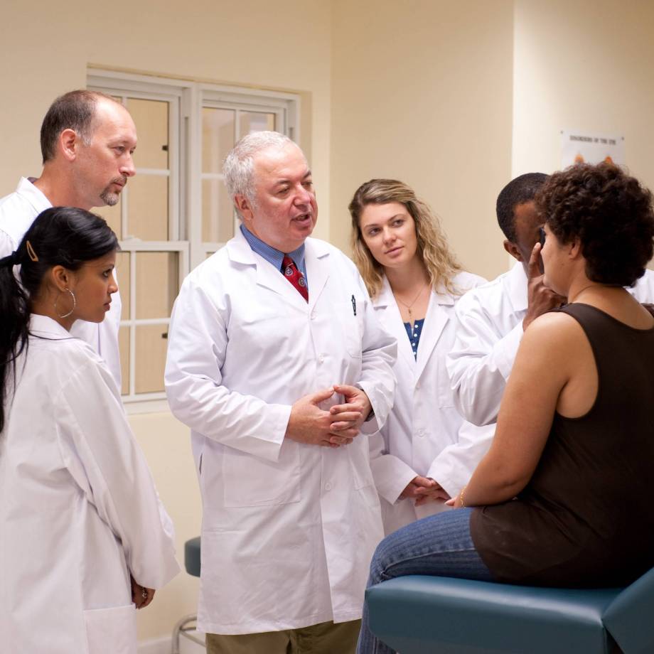 MUA - Group of Doctors Evaluating the Patient